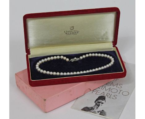 A single strand of Mikimoto cultured pearls, length 36cm, pearls approx. 6mm each, clasped marked 'M' within a clam and also 