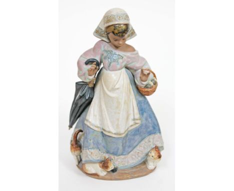 A Lladro figure of  a girl with umbrella, basket and kittens, height 28cm. Condition - very good, no damage/repair, little/no
