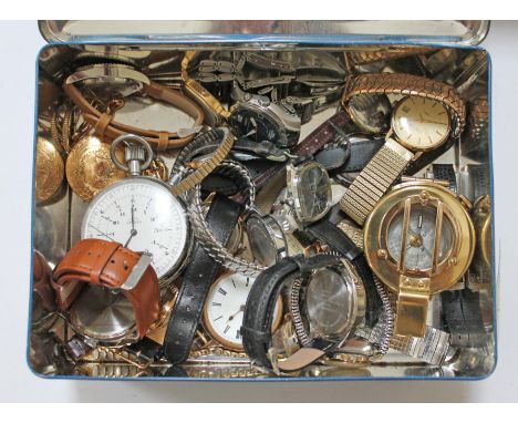 A tin of vintage wristwatches and a reproduction brass compass.