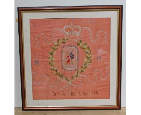An Early 20th Century souvenir sampler, 41cm x 42cm, glazed and framed 53cm x 55cm.