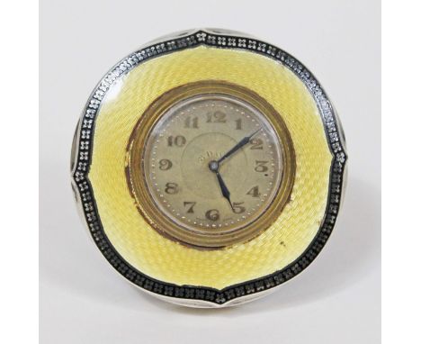 An Art Deco hallmarked silver and enamel 8 day clock, diam. 8cm.