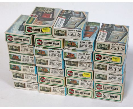 A group of 28 Airfix OO gauge model railway wagon kits.