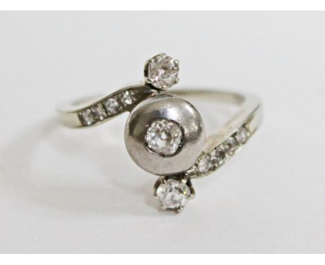 A white metal diamond ring, gross wt. 4.5g, size R.