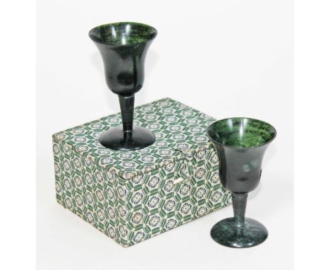 A pair of turned jade goblets, height 10cm each, boxed.