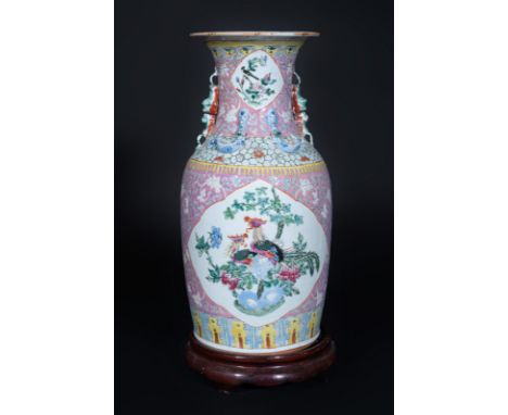 Chinese Art A porcelain vase painted with birds within reservesChina, 20th century . . Cm 43,00. Wooden stand.