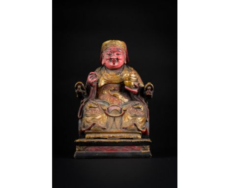 Chinese Art A gilt lacquered wooden statue of a Taoist seated figureChina, Qing dynasty, 18th-19th century . . Cm 15,50 x 25,