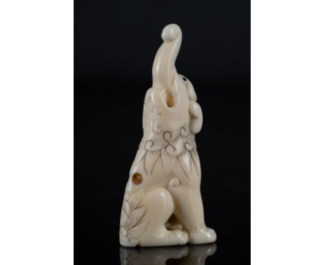 Japanese Art An ivory netsuke depicting an elephant with upward truck Japan, 19th century . . Cm 3,00 x 7,00 x 2,00.