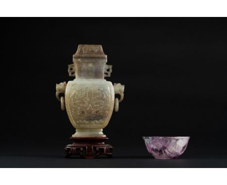 Chinese Art A fluorite cup and a jade vase carved with archaic motifsChina. . Cm 8,60 x 4,00.