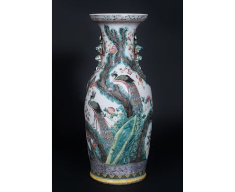 Chinese Art A baluster porcelain vase painted with a peacock and vegetal motifs China, 19th century . . Cm 60,00. Restored