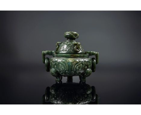 Chinese Art A spinach jade tripod censer and cover carved with vegetal motifs China, 18th-19th century. . Cm 12,00. Wooden st