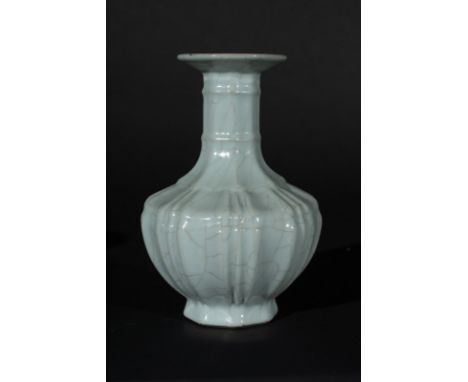 Chinese Art An octagonal faceted shaped guan glazed porcelain vase bearing a six character seal Qianlong mark at the base Chi