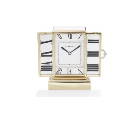 CARTIER: DESK CLOCK, CIRCA 1930The reeded doors set with a rose-cut diamond clasp, opening to reveal a rectangular dial, the 