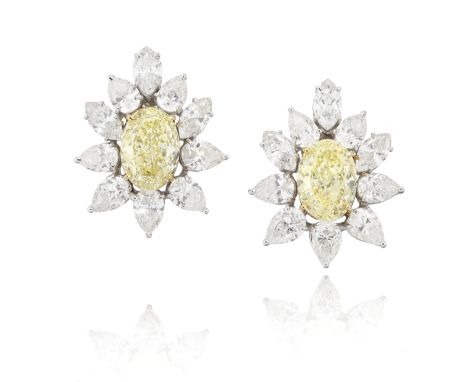 PAIR OF FANCY COLOURED DIAMOND AND DIAMOND EARRINGSEach oval-cut Fancy Light Yellow diamond, weighing 7.17 carats, or Fancy Y