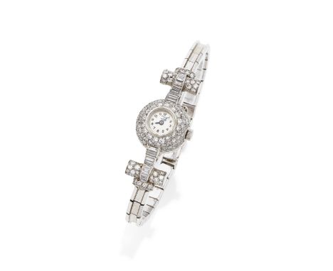 VAN CLEEF &amp; ARPELS: ART DECO DIAMOND COCKTAIL WATCH, CIRCA 1935The circular cream dial with Arabic numerals, blued steel 