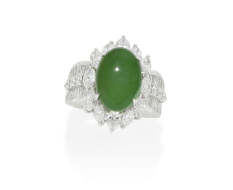 JADE AND DIAMOND DRESS RINGThe oval jade cabochon, weighing 8.45 carats, within a surround of marquise-cut and pear-shaped di
