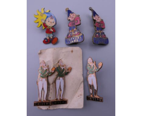 A collection of enamel badges, including Noddy.