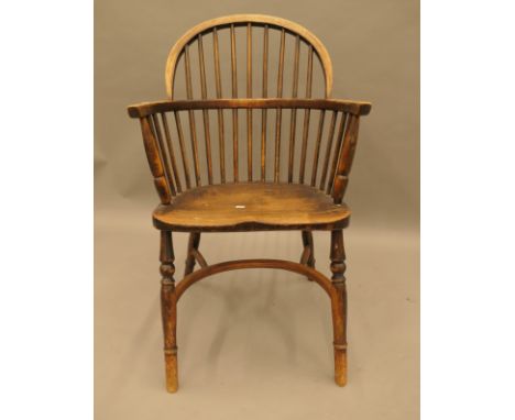 A 19th century elm seated stick back Windsor chair. 52 cm wide.