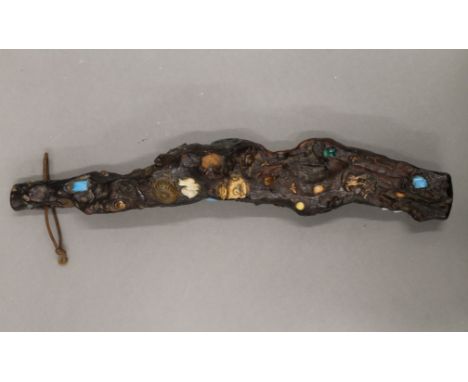 An Oriental root stick set with assorted items, including a Buddha, semi-precious stones, etc. 33 cm long.