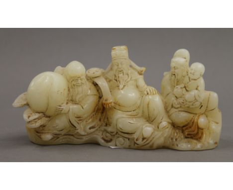 A Chinese carved jade figural brush rest. 16 cm wide.