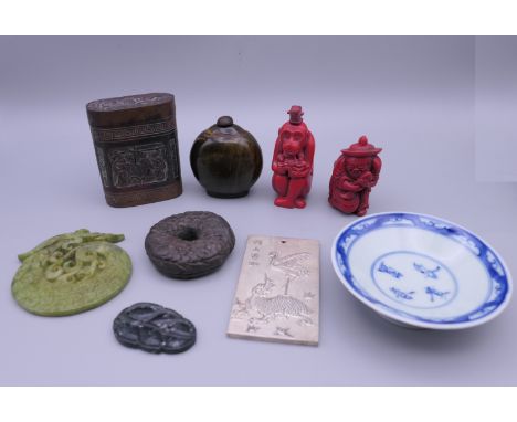 A quantity of small Chinese items, including jade roundels, a horn snuff bottle, etc.