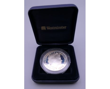 A 1998 silver proof coin, cased. 