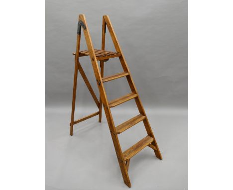 A vintage folding step ladder. 155 cm high.