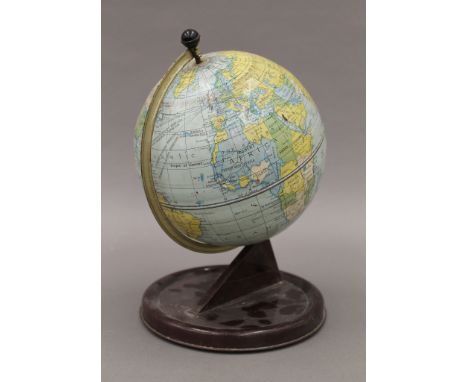 A Chad Valley tin globe. 26.5 cm high.