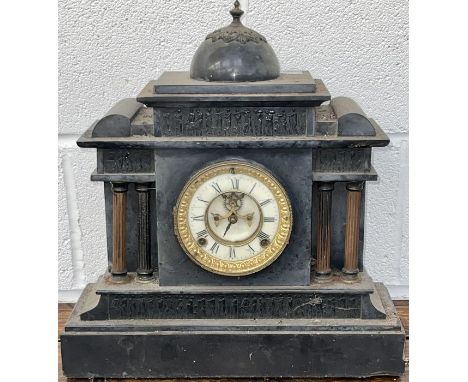 A slate clock with classical columns
