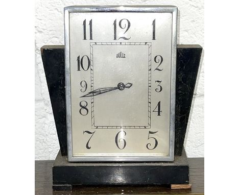 An Art Deco French Bulle electric mantel clock.