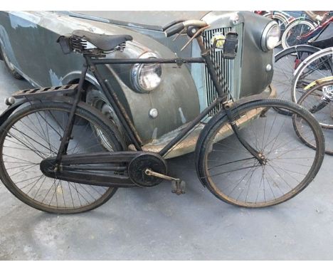 A 1920s Raleigh Gentleman’s Tourer. It boasts a Brookes saddle, Elco gears and an acetylene lamp.&nbsp;
