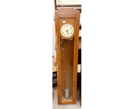 A Telephone Rentals oak long case electric clock with glass door c1930.&nbsp;