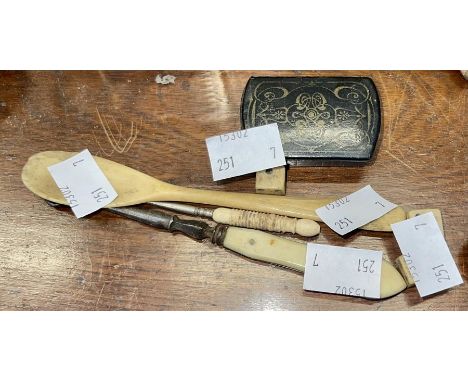 A mixed lot to include an ebonized mid 19th century snuff box, a bone spoon an ivory button hook, three bone dice and one oth