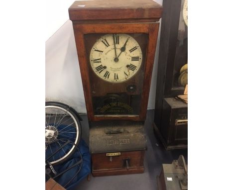 A national time recorder clocking in clock in an oak case, Aquinas of London