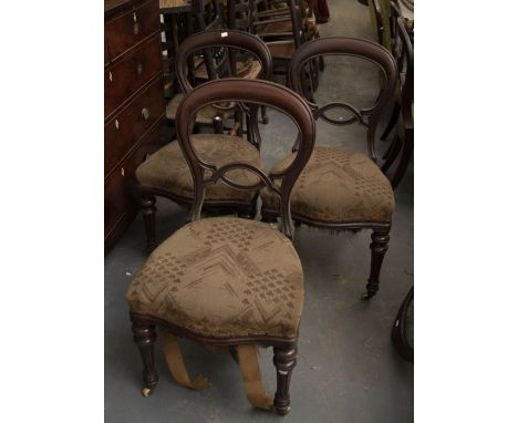 A set of six Victorian balloon back chairs, upholstered seats on turned front legs with ceramic castors and rear sabre legs s