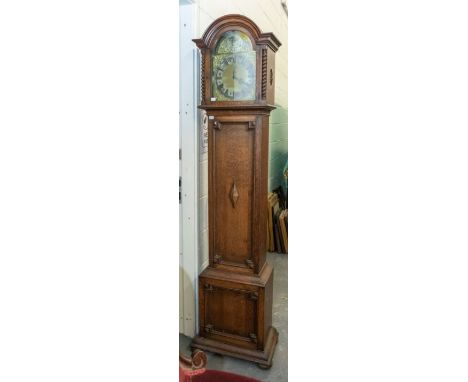 A 19th century oak cased longcase clock, metal dial with roman numerals, surmounted by gilt and cherub and scroll decoration,