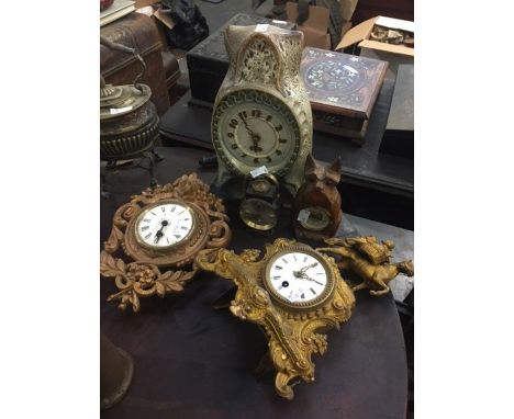 Five interesting clocks, one West German ceramic, one carved wooden clock in the form of a dog and one alarm clock in the for