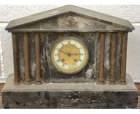 A slate mantel clock with columns