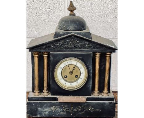 A slate mantel clock with columns gilding and classical frieze