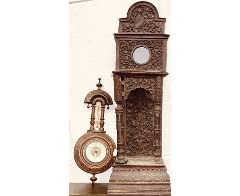 An Anglo Indian miniature grandfather carved clock case and one mahogany barometer (2)