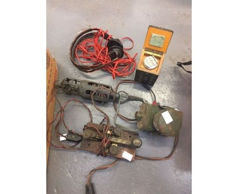 A wood and brass morse code tapper, a military morse code lamp, a military harmonizing unit in box and &nbsp;a pair of USA si