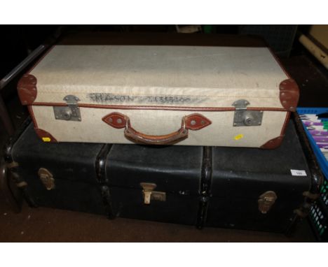 A BOUND PACKING TRUNK, TOGETHER WITH A VINTAGE SUITCASE