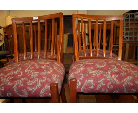 A SET OF FOUR LADDER BACK CHAIRS