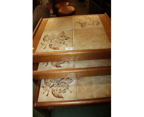 A RETRO TILE TOP NEST OF TABLES 