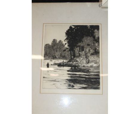 A FRAMED ETCHING OF A MAN FISHING IN A RIVER 