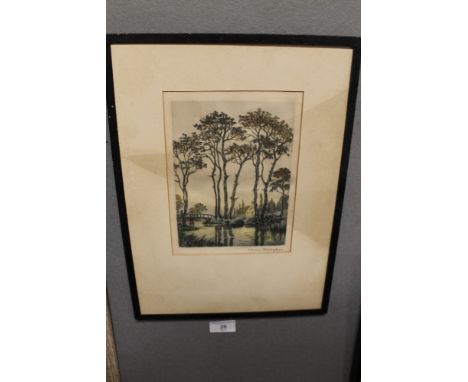A FRAMED COLOURED PRINT OF TREES BY A RIVER 