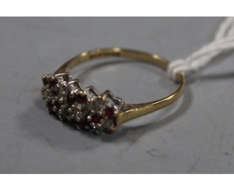 A GOLD RUBY AND DIAMOND RING