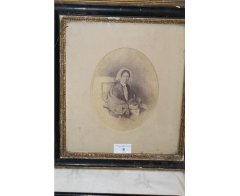 A FRAMED AND GLAZED PORTRAIT OF A LADY 