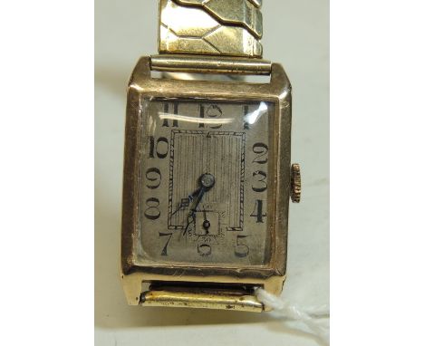 A Gents 9ct gold Art Deco wristwatch, manual wind, rectangular tarnished silvered face with black arabic numerals, square sub