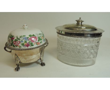 An Edwardian oval cut glass and silver plated biscuit barrel together with a later silver plated muffin dish with ceramic cov