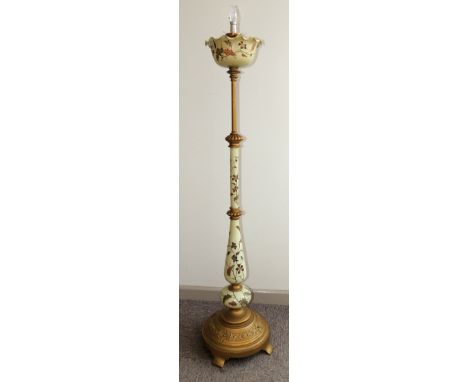 A decorative telescopic standard lamp constructed with cast gilt brass and painted pottery sections, un-marked, with small et